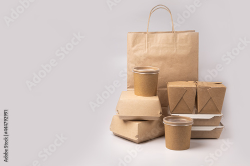 Disposable food delivery packaging on gray background