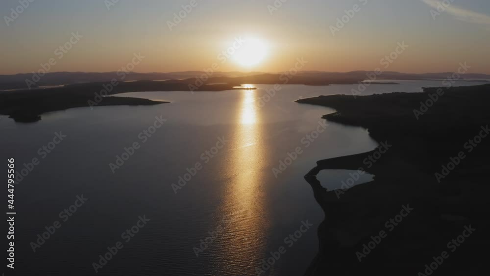 Sunrise over the Sea of Japan. Calm sea in calm, shining reflections Sunrise over the Sea of Japan. Calm sea in calm, shining reflections