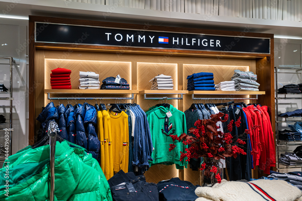 DUSSELDORF, GERMANY 19 OCTOBER, 2019: Interior shot of Tommy Hilfiger store in Breuninger luxury mall at Schadowplatz in city center Dusseldorf, Germany Stock Photo Adobe Stock