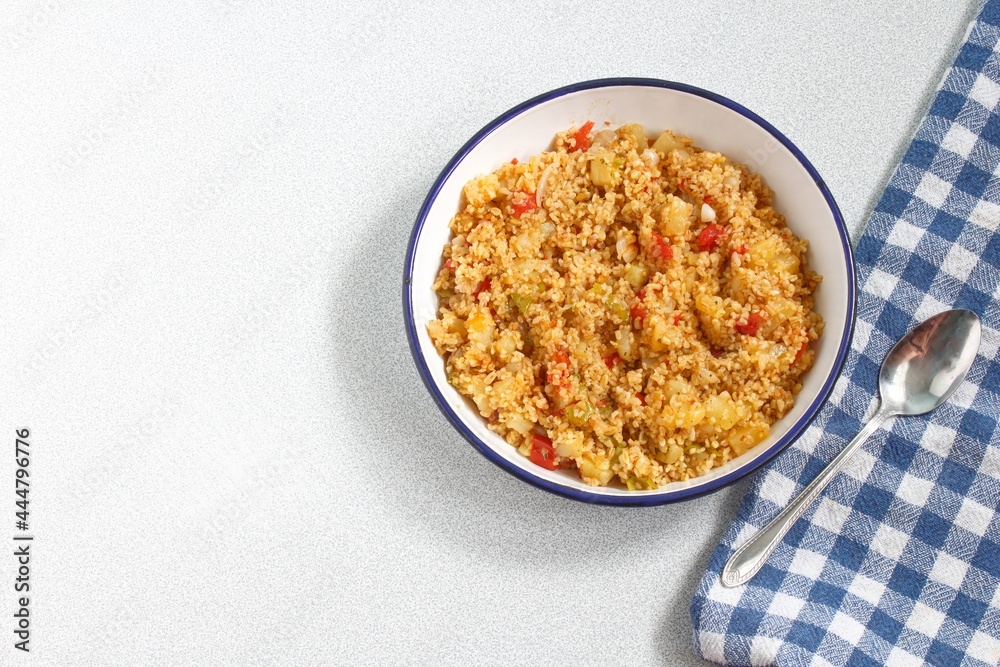 Top view of bulgur pilaf isolated on white background with copy space. Top view of bulgur pilaf isolated on white background with copy space.