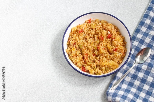 Top view of bulgur pilaf isolated on white background with copy space.