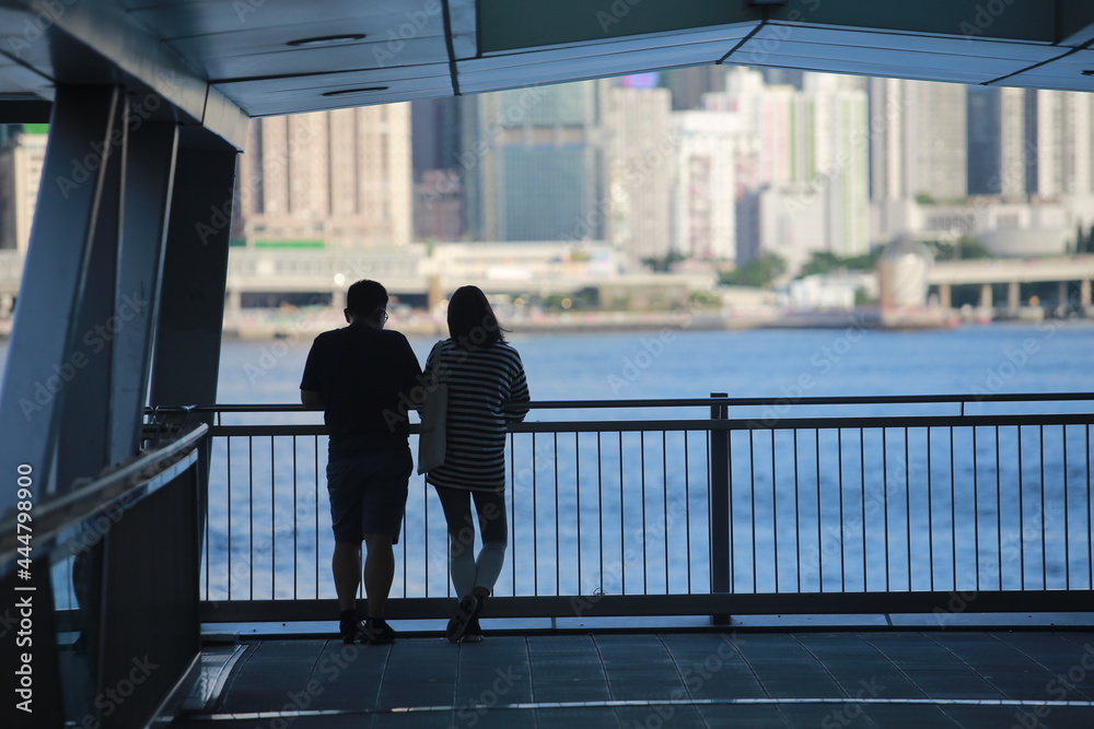 hong kong people back rear with the cityscape view in front of the victoria harbour hong kong people back rear with the cityscape view in front of the victoria harbour
