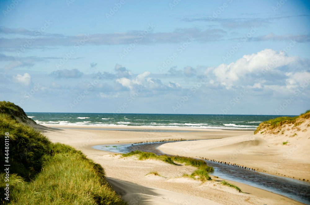 Summer in the sand dunes and at the North Sea in Denmark. Sea, Nordic light, grass, straw and sandunes. Summer in the sand dunes and at the North Sea in Denmark. Sea, Nordic light, grass, straw and sandunes.