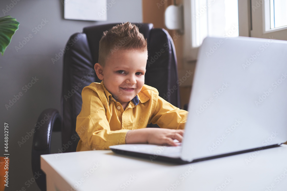 Young boy playing video games on the computer Young boy playing video games on the computer