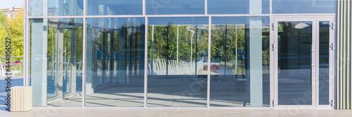 Panoramic view with large glass doors and windows in a building under construction