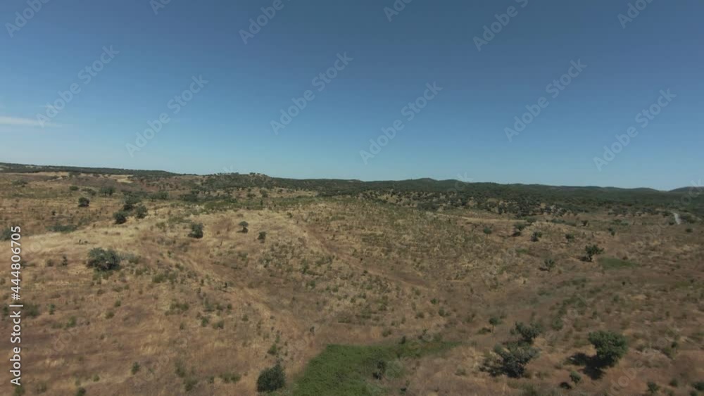FPV Drone Aerial irrigation damm countryside landscape view of Alentejo, tourism destination region, Portugal. FPV Drone Aerial irrigation damm countryside landscape view of Alentejo, tourism destination region, Portugal.