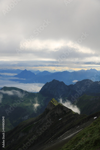 Sunrise scene seen from Mount Brienzer Rothorn. View towards Stanserhorn and Lucerne. Fog lifting slowly after a rainy night.