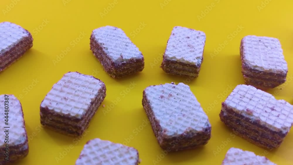 blurred wafers with chocolate on a pink background