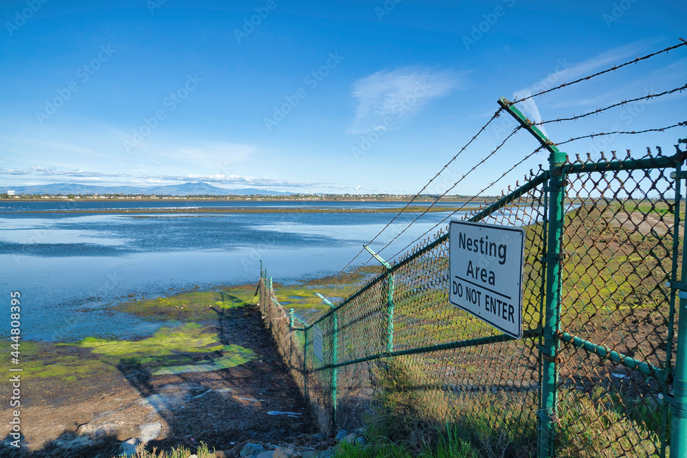 Fototapeta premium Bolsa Chica Ecological Reserve nesting area for wildlife against wetland and sky
