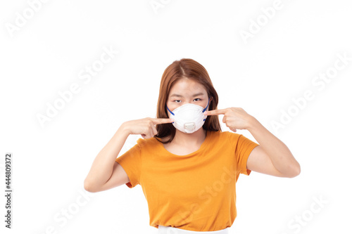 Young Asian woman wearing face mask, mask mouth protect filter pm2.5 anti pollution, anti smog and protection covid 19. Air pollution, environmental concept.