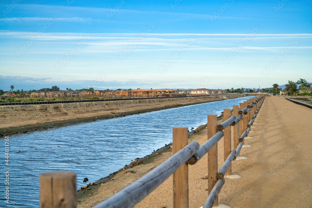Water lined with wooden fence at Bolsa Chica Ecological Reserve in California
