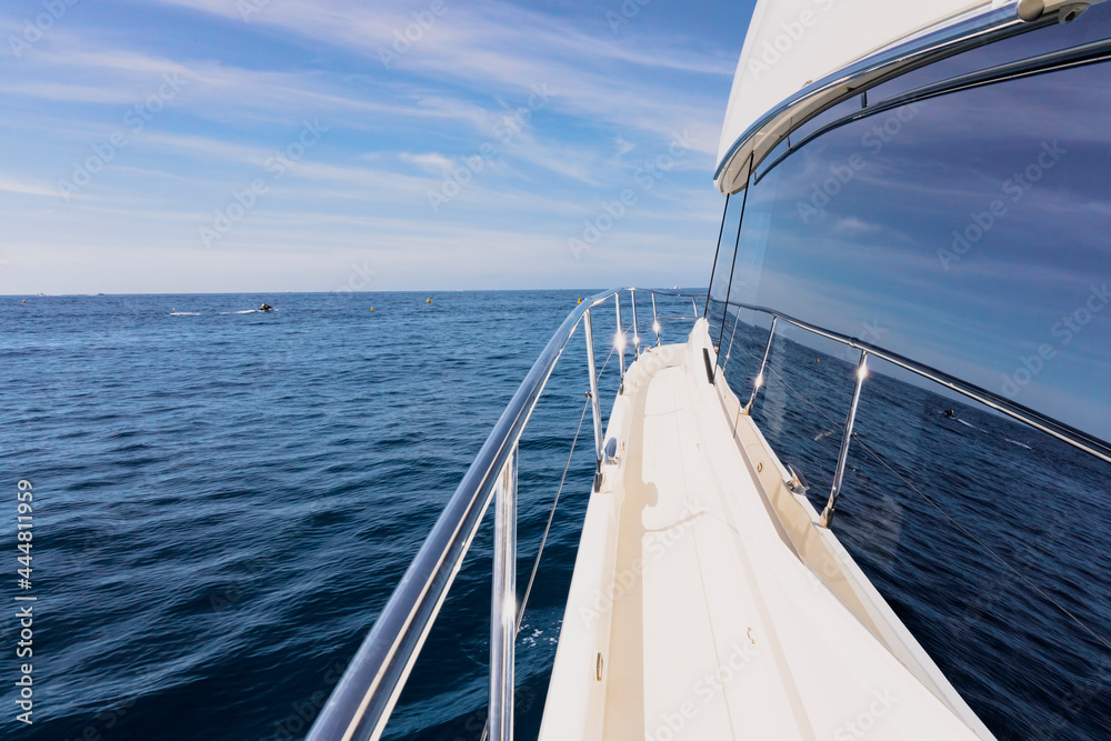 Obraz premium Luxury motor yacht in the azure Mediterranean sea at full speed.Expensive yacht.