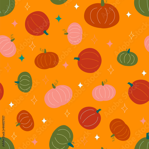 Seamless vector pattern with pumpkins. Halloween print. Cozy and cute. Trendy colors of the autumn. Perfect for scrapbooking paper, textile, fabric, card