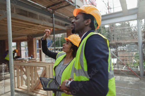 Engineers talking at construction site photo