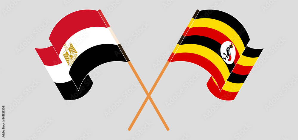 Crossed and waving flags of Egypt and Uganda Crossed and waving flags of Egypt and Uganda