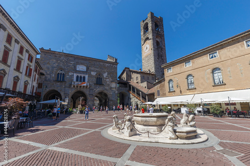 Bergamo, Italy - July 10, 2021: street view of Bergamo Alta citadel in full daylight, people are visible in the distance.