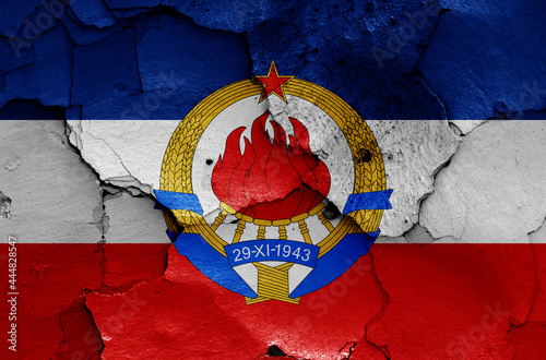 Photography historical flag of Yugoslavia painted on cracked wall