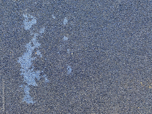 Blue rubber surface anti-traumatic safety tile on workout sports playground in public park or courtyard. The background. Texture