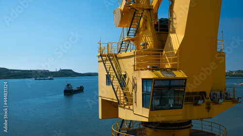 Принти на полотні Cabin of the multi purpose cargo crane and Santiago de cuba harbor on the back g