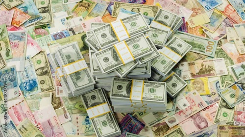 One million dollars and banknotes from different countries close up rotation.