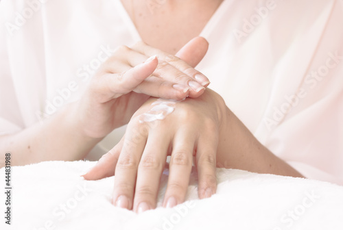 View of woman s hand applying moisturizer. Skin protection of a young woman s hand applying moisturizer. Healthy lifestyle