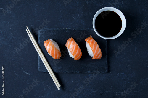 Gourmet sushi served on black slate plate