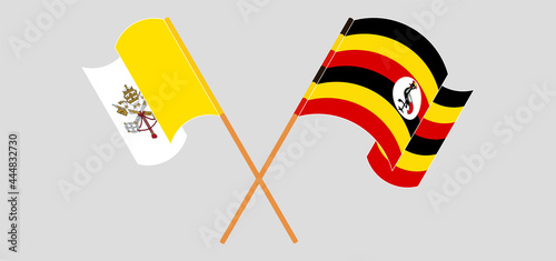 Crossed and waving flags of Vatican and Uganda