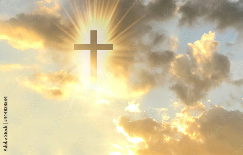 Christian cross appears bright in the gold sky Christian cross appears bright in the gold sky
