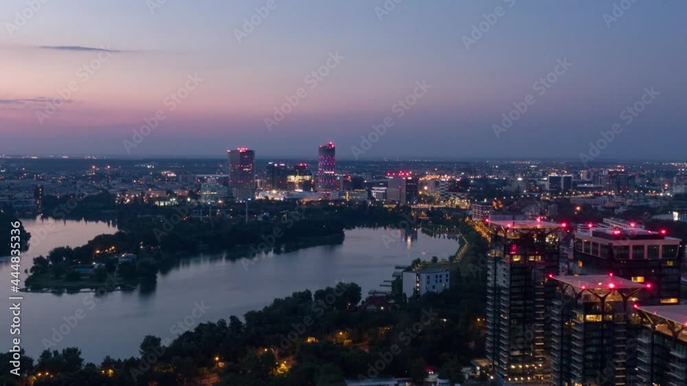 Aerial Drone Helicopter Hyperlapse Timelapse Of Bucharest City Skyline Business District Sky Tower Distant View  At Dusk