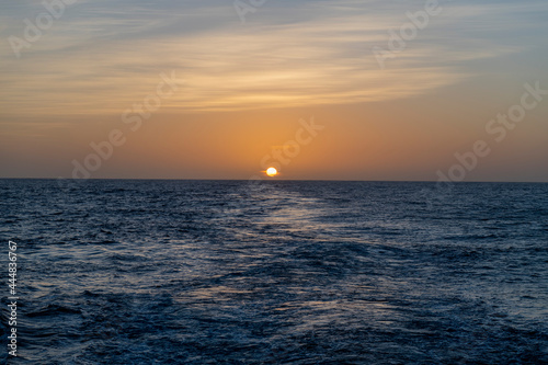 Beautiful seascape - waves and sky with clouds with beautiful lighting. Golden hour. Sunset at sea. © Alexey Seafarer