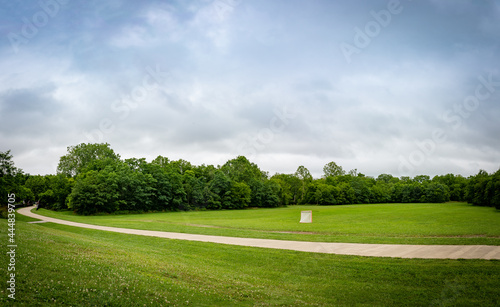 Panorama of a lawn field with lacrosse goals stored and locked together in Veteran's park in Lexington, KY USA during early morning hours