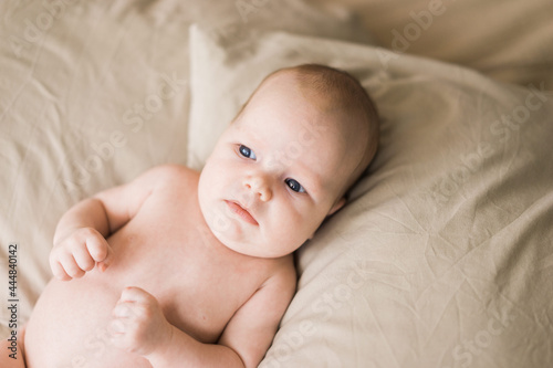 infant baby lying in pillows
