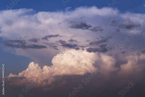 Epic dramatic storm sky. Big large white cumulus clouds against blue sky background, cloud abstract texture, thunderstorm © Viktor Iden