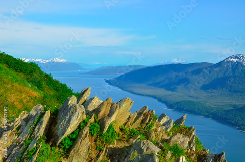 Alaska landscape mountains and water, rock picks, aerial perspective view. Remote location, unplugged. Wild beauty in nature. Untouched environment. photo