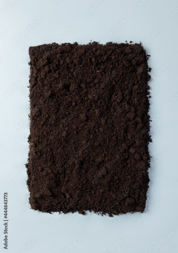 Frame from the ground on blue background. Minimalistic concept compostable or biodegradable with copy space. Pollution reduction idea Frame from the ground on blue background. Minimalistic concept compostable or biodegradable with copy space. Pollution reduction idea