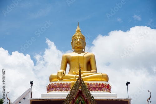 Big Buddha on rooftop in Nong Khai province  Thailand. Low angle.