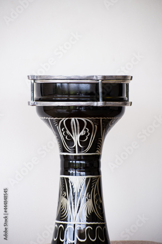 The goblet drum or darbuka drum is a single head membranophone with a goblet shaped body used mostly in Egypt and is considered the National symbol of Egyptian Shaabi Music photo