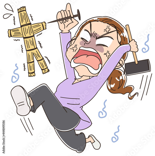 わら人形で呪いをかける女性