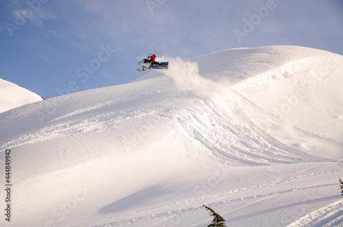 Sledder jumping in Alaska backcountry
