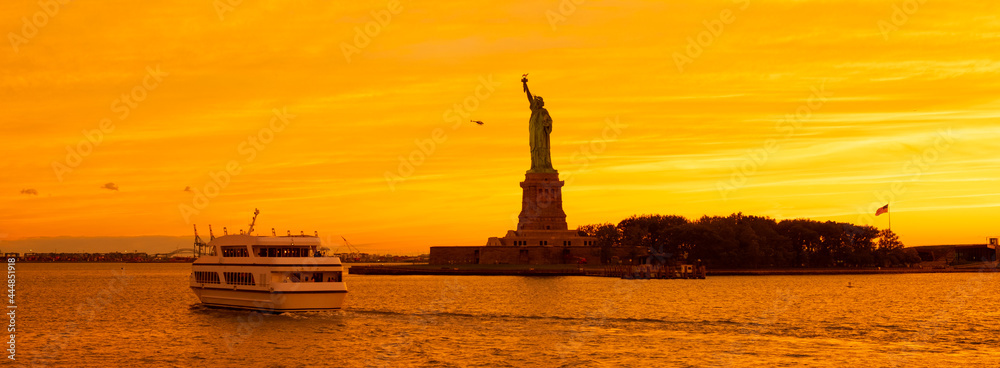 The Statue of Liberty at New York city during sunset