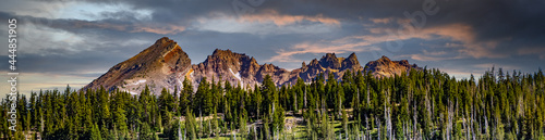 A panorama image of Broken Top mountain as it looms above Todd Lake in the late afternoon on a hot summer day, on Century Drive near Bend Oregon photo