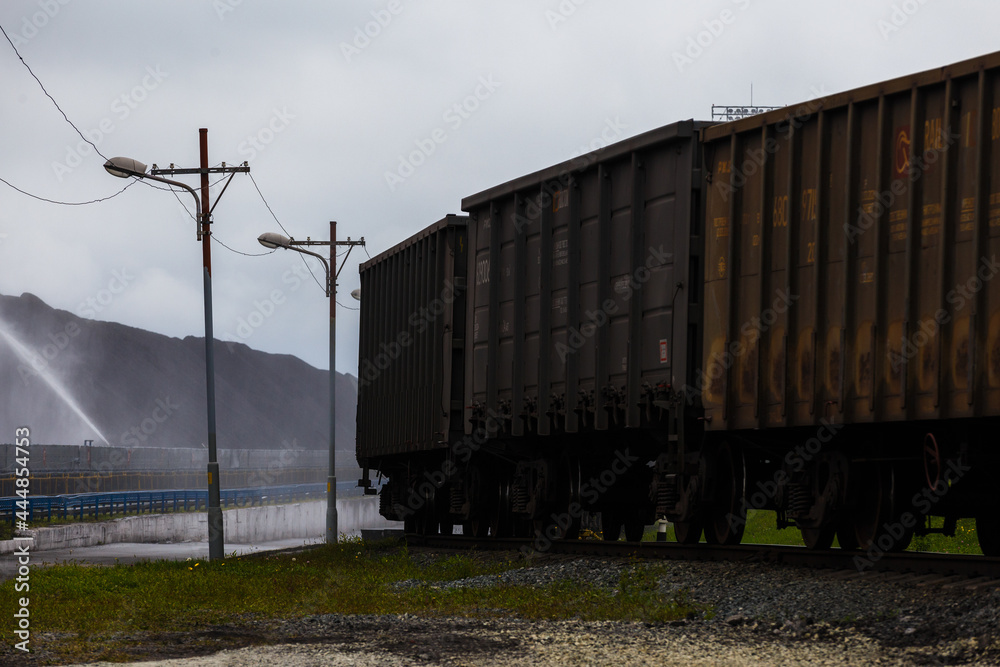Open-air coal terminal. Railroad cars are waiting for coal to be loaded into them. Open-air coal terminal. Railroad cars are waiting for coal to be loaded into them.