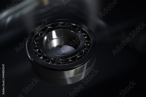 3D illustration metal silver ball bearing with balls on black isolated background. Bearing industrial. This part of the car