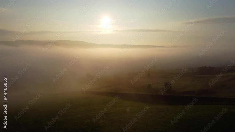 Fog morning over the Yorkshire Dales, meadow near a rural village, aerial view landscape Fog morning over the Yorkshire Dales, meadow near a rural village, aerial view landscape