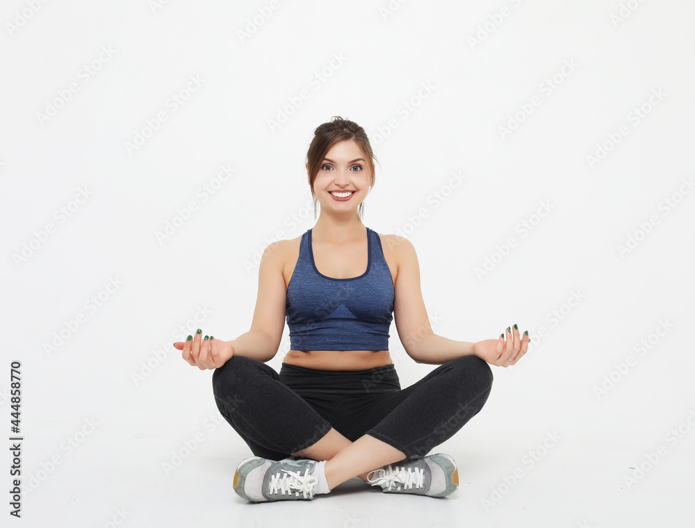 sport, yoga and people concept - lovely young woman doing yoga, sports exercises for relaxation and meditation sport, yoga and people concept - lovely young woman doing yoga, sports exercises for relaxation and meditation