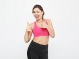portrait of a smiling fitness woman in headphones working out isolated over white background