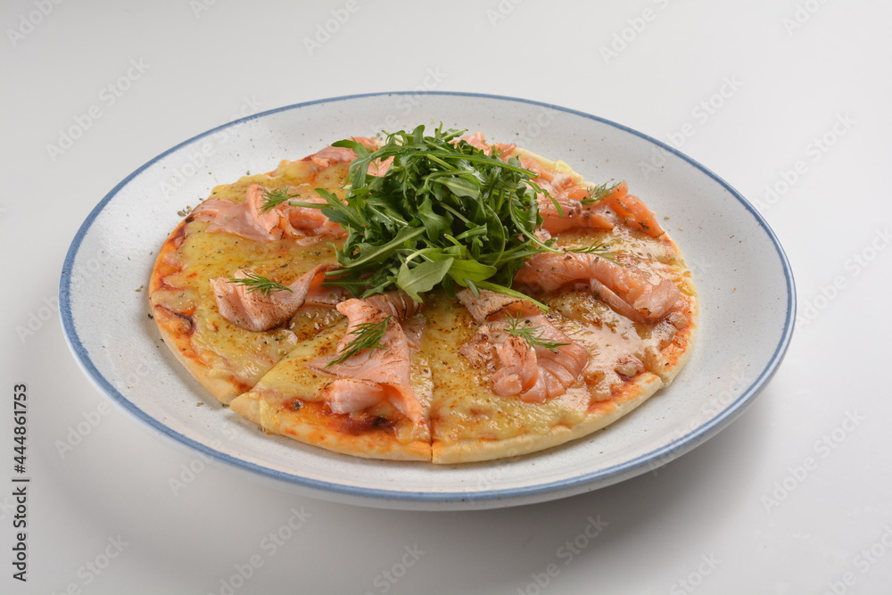 baked cheesy pizza with smoked salmon seafood and salad in white background western halal menu baked cheesy pizza with smoked salmon seafood and salad in white background western halal menu
