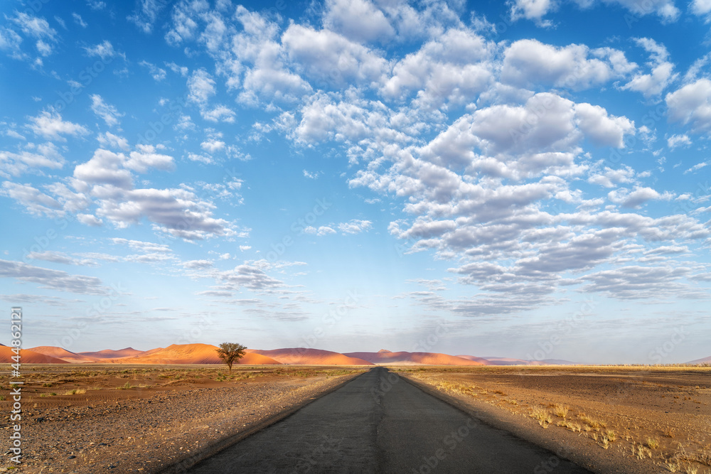 Inspirational, scenic road near Sossusvlei in the Namib-Naukluft National Park, Namib desert, Namibia, Africa. 