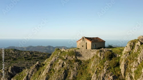 Aerial drone view of the hermitage of Santa Eufemia on the top of a mountain in Aulestia in the Basque Country photo