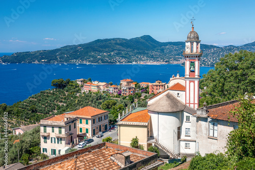 Chivari, Italy, 23 June, 2019 - view of Chiesa Sant'Andrea di Rovereto at Chiavari, Portofino area visible on the horizon.